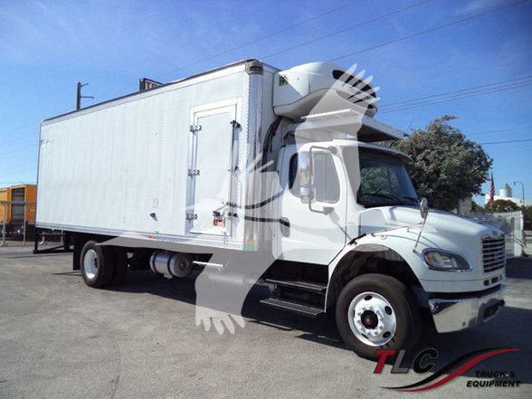 2016 Freight/box truck in-service with a white reefer box mounted on a mid-roof cab. Side view shows cargo box, refrigeration unit at front of box, dual rear wheels, and cab steps.