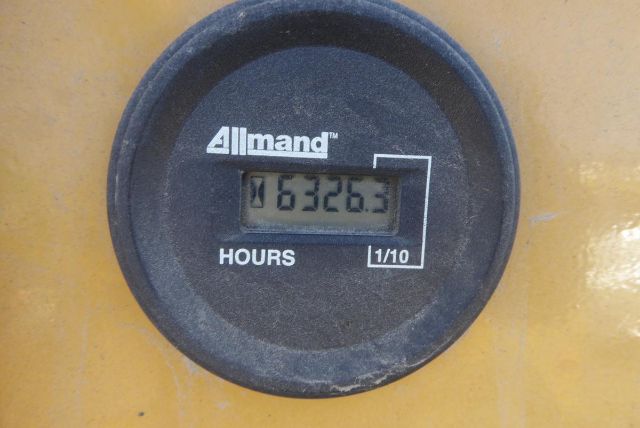 Allmand hour meter reading 632.63 showing hours 1/10 label on yellow equipment.
