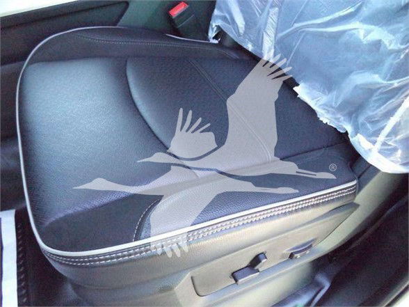 Ram 5500 interior seat with plastic cover and custom stitching detail visible.