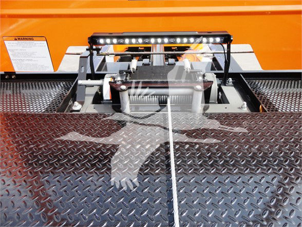 Peterbilt 337 truck component showing winch mount and diamond plate deck with LED light bar on top.