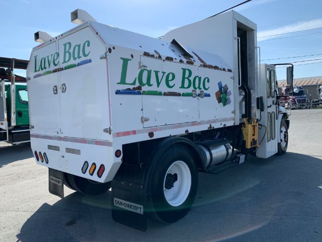 2006 International 4300 garbage truck with Lave Bac branding, side view showing rear compactor and white wheels.