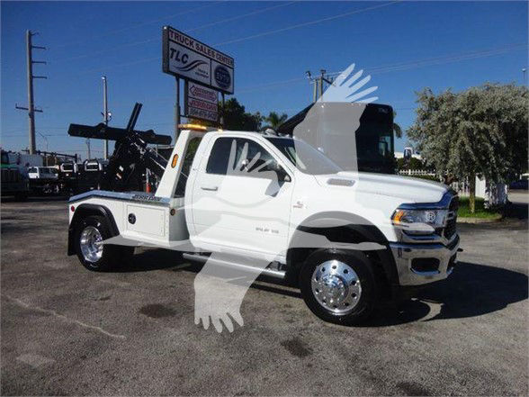 Ram 4500 tow truck with flatbed, white exterior, front cab view, stock number J74215, Bla.