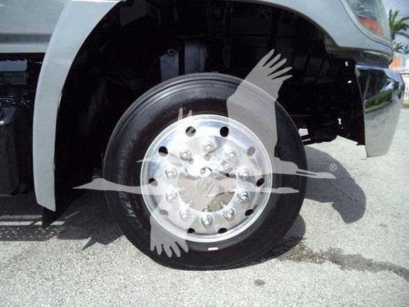 Hino 258ALP front left wheel well view showing wheel and fender with some undercarriage visible.