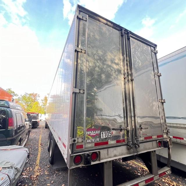 Rear view of a 2019 Wabash Arctic Lite refrigerated trailer. SSL doors closed, dual rear doors with latches, Wabash Arctic Lite branding, license plate area with number 1105, bumper guards, reflective tape.