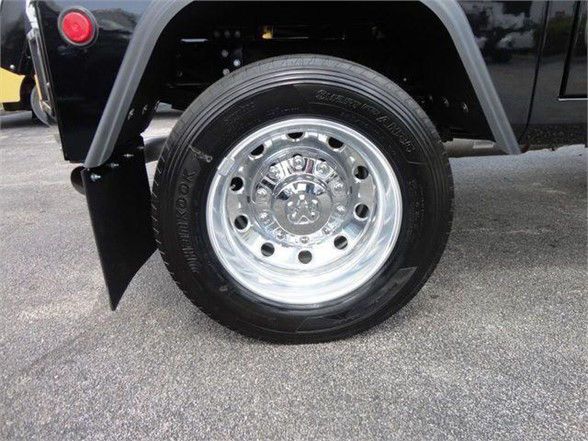 Front wheel and tire of a 2024 Ram 4500 HD SLT showing wheel and fender details.