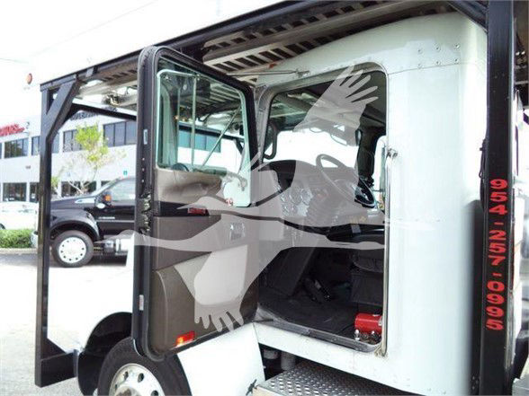 Kenworth T370 truck cab interior and door open, step access visible, side door open showing interior seating area.