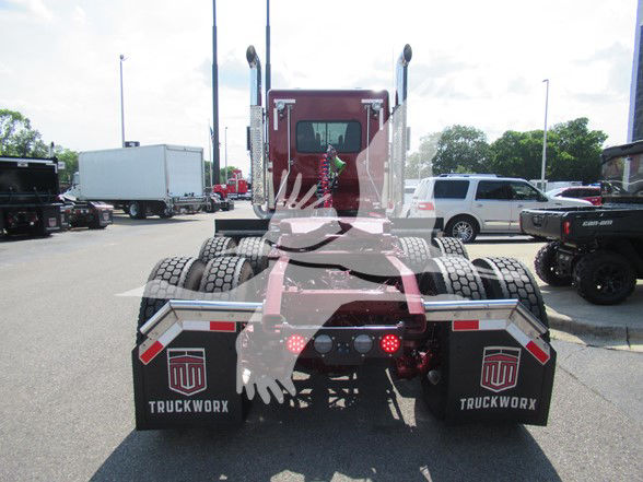 Kenworth W900L tractor rear view showing dual rear axles and mud flaps with Truckworx branding.