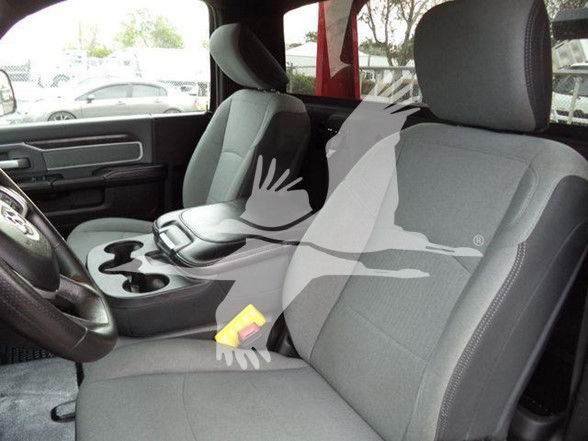 Ram 4500 interior showing front seats, steering wheel, center console, and gray fabric upholstery.