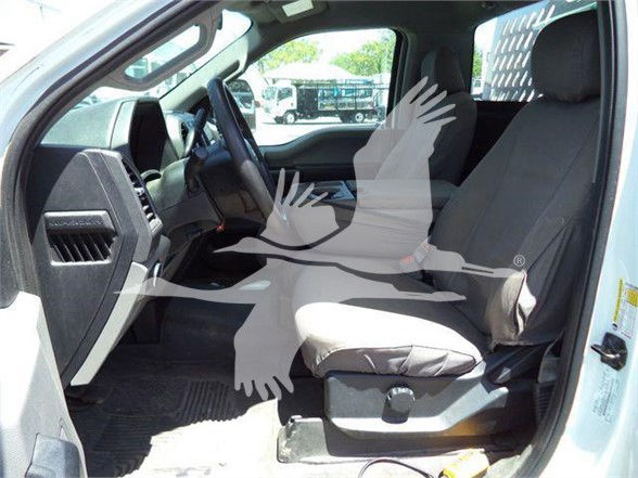 Ford F-250 interior showing front bench seat and dashboard with steering wheel; watermark overlay obstructs some view.