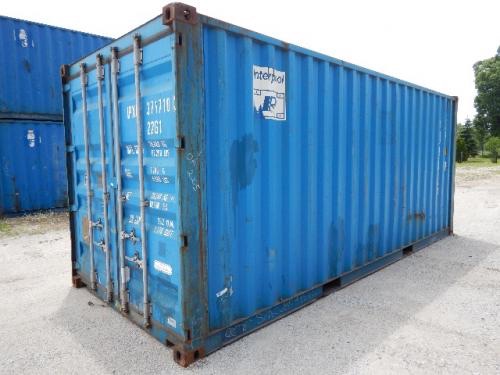 Container with blue exterior showing white shipping markings and doors at the end; various numbers and labels on the door and side.