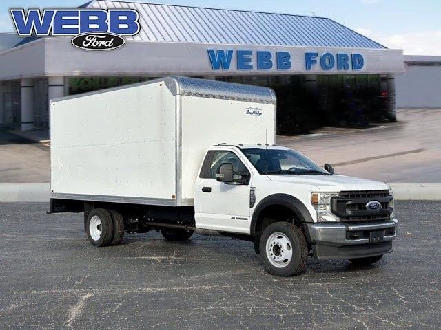 White Ford F-550 box truck in front of Web Ford dealership building.