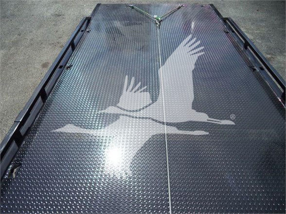 Diamond plate truck bed with an Egret graphic silhouette spanning the center