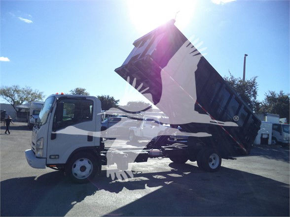 Isuzu NRR dump truck in a tilted bed position with front cab visible.