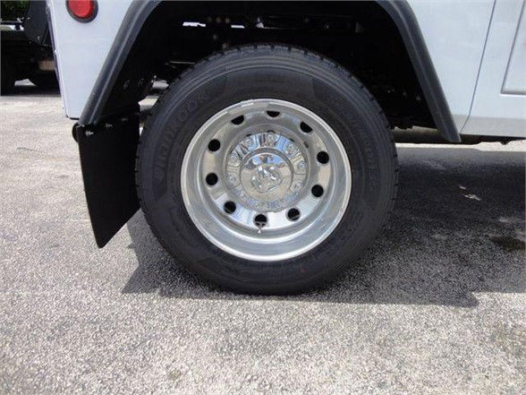 RAM 4500 wheel and tire close-up showing polished steel rim and tire sidewall.