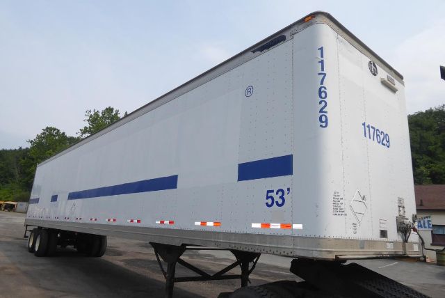 Great Dane trailer showing 53' length with blue stripe and wheel area, rear doors and vertical numbers 117629 and 117629 on white exterior.
