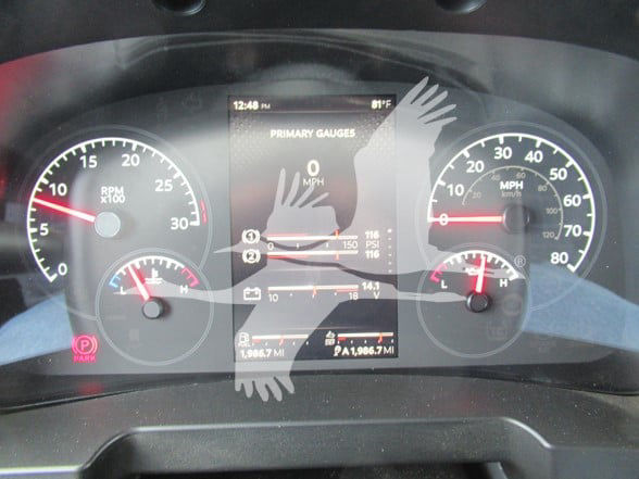Kenworth T380 instrument cluster showing speedometer, tachometer, and digital display with primary gauges.