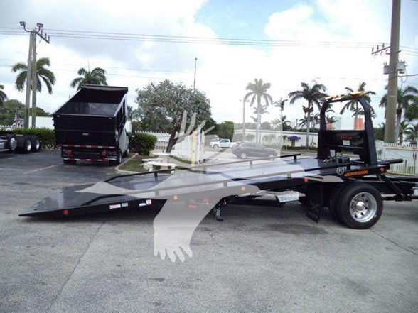 Flatbed tow truck with long angled ramp and wheel chocks, International DURASTAR 4300, VIN 1HTMMMML4KH512255.