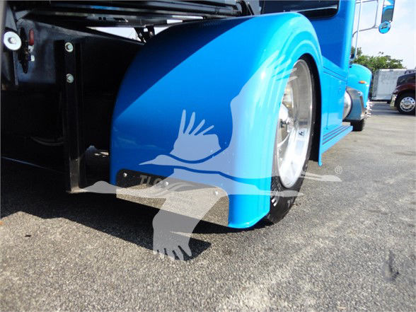Peterbilt 337 truck rear-side showing bright blue fenders and wheel wells, with black step and chrome wheel.