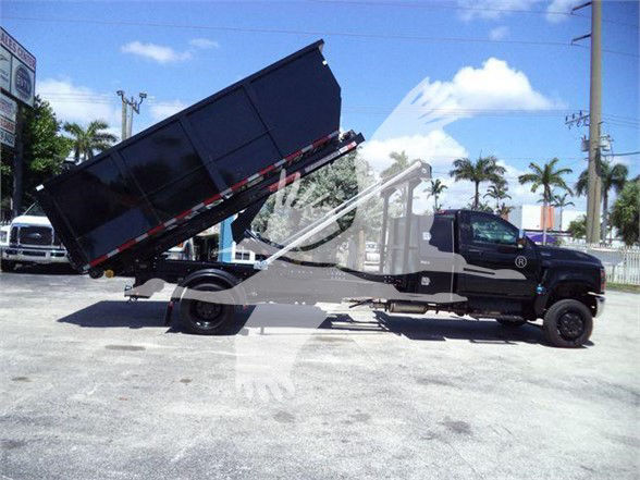 New 2023 International CV dump truck with cargo bed raised in a lot, stock CV515REG14SNG1.