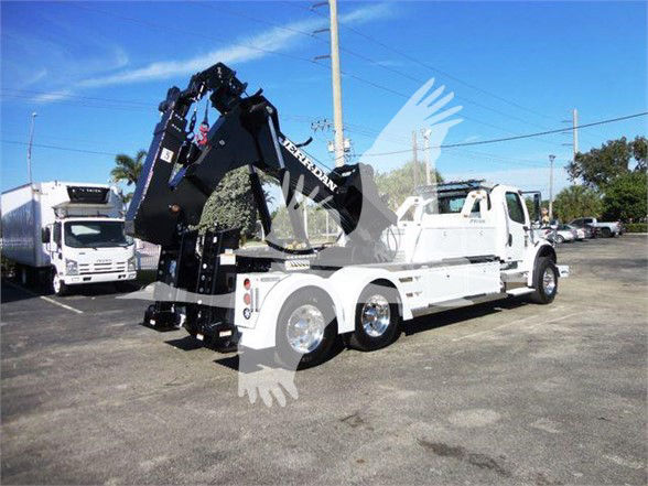 Tow truck with a mounted hydraulic crane on a Freightliner Business Class M2 106 chassis.