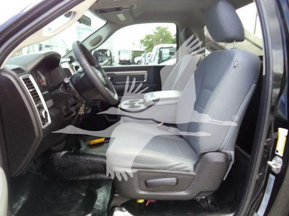 Ram 4500 interior showing front seats and dashboard view from driver side with gray cloth seats and steering wheel.