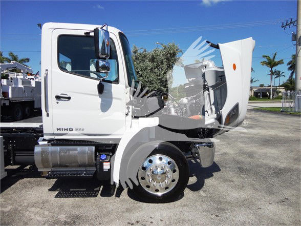 Hino 268A cab front view with hood open showing engine bay and front wheel.
