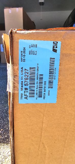 Blue label on cardboard box reading: TRK# Made In USA AFT# 576227 SHP DATE 02-15-2024, ... HL, L4E4H Renr Crtr HERON GREY F