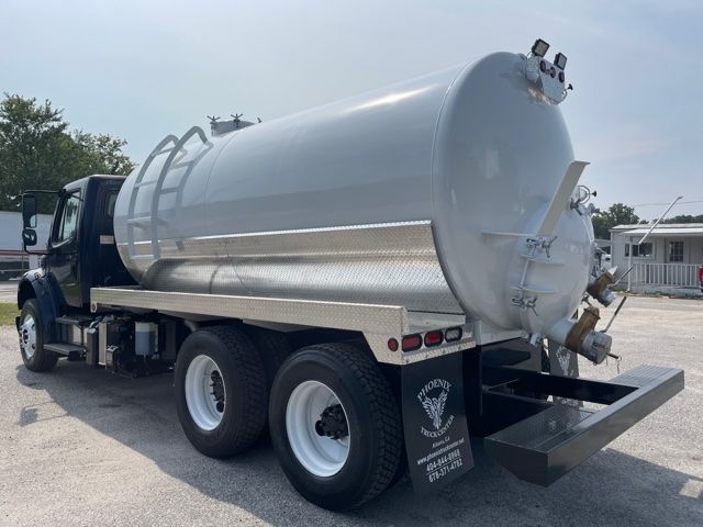 2013 Freightliner M2 vacuum/sewer suction tanker truck side and rear showing cylindrical tank with rear discharge and lift gate.