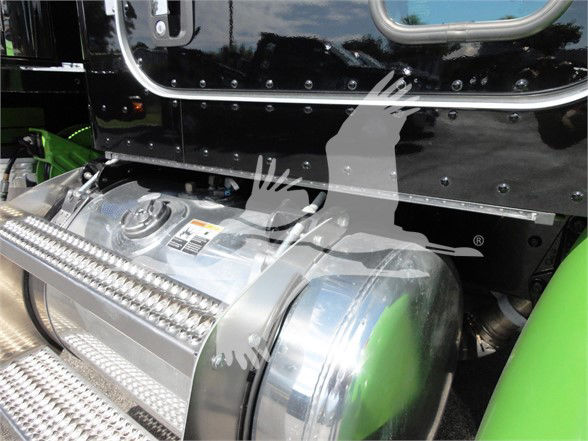 Peterbilt 337 truck image showing fuel tank with chrome finish and ladder-style step, black body with riveted panels, green accents on side.