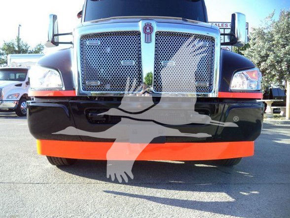 Kenworth T280 front view showing chrome grille, headlights, black bumper with orange skid plate and large Kenworth emblem.