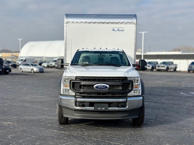 Ford F-550 truck front view with cargo box, headlights, grille, and Ford emblem visible.