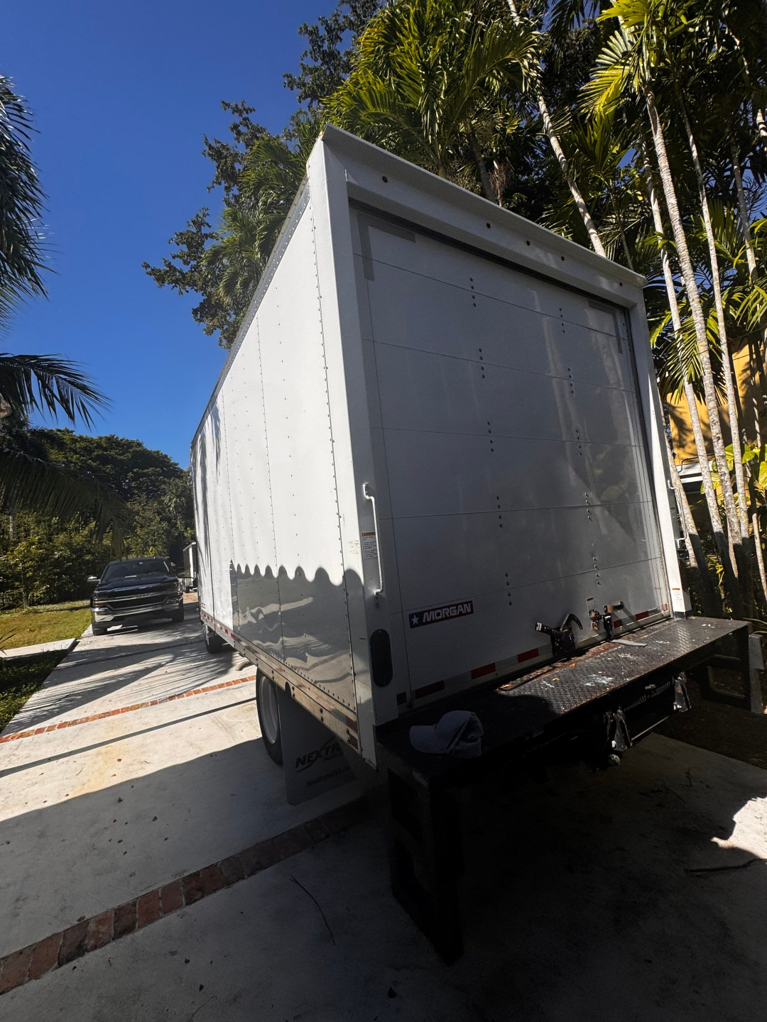 Isuzu box truck trailer rear view showing Morgan trailer logo and liftgate.