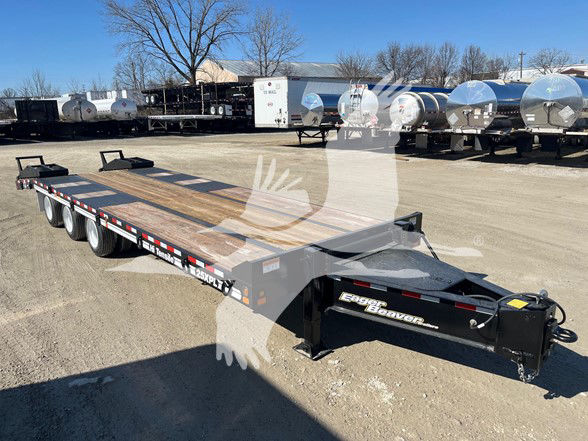 Trailer: 2025 Eager Beaver 25Xpl flatbed trailer with three axles in an outdoor lot; brand name 'Eager Beaver' on hitch area; multiple tanker trailers visible in background.