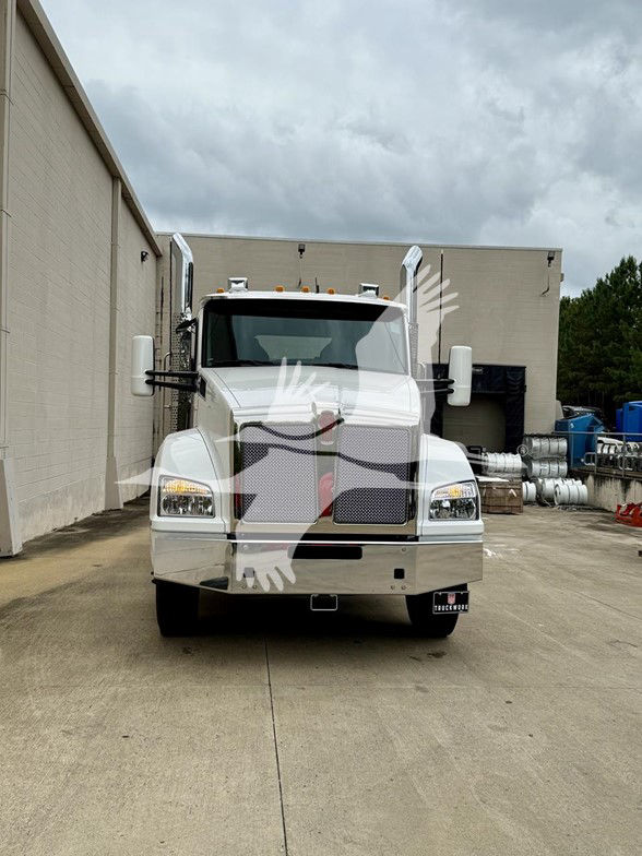 Kenworth T880 truck front view in white, rectangular grille, dual mirrors, front bumper, and headlights visible.