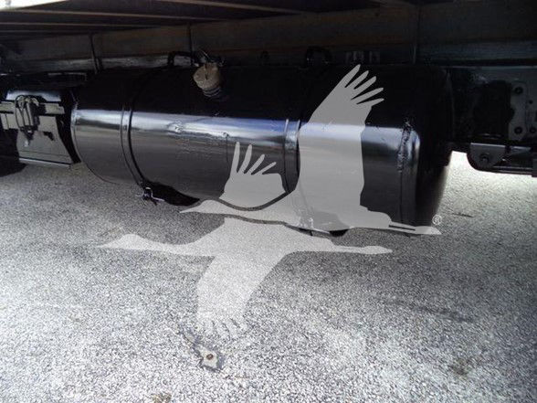 Underbody view of a 2020 Isuzu NPR HD truck showing a cylindrical fuel tank/kind of tank under the chassis.