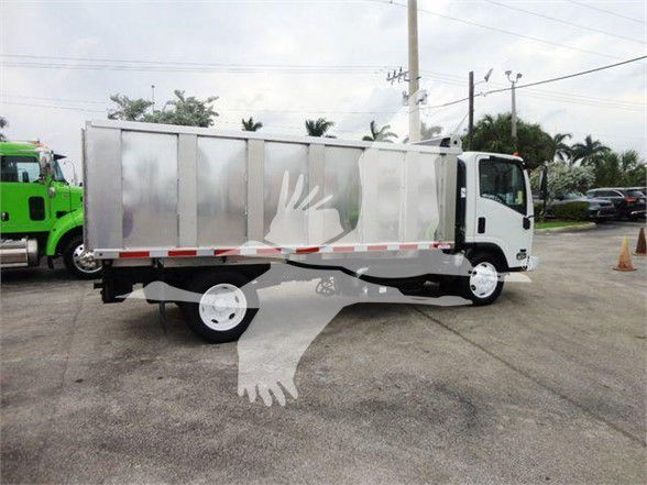 Isuzu NQR dump truck in view with silver cargo box and white cab.