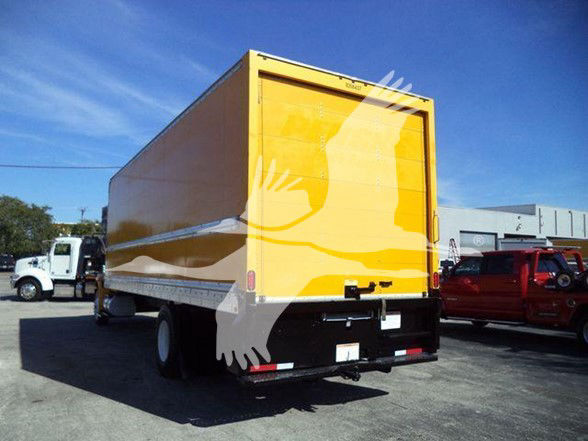 Box truck rear view showing yellow cargo box and black bumper with taillights.
