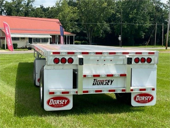 All-aluminum 48ft flatbed trailer back view showing Dorsey branding and mud flaps.