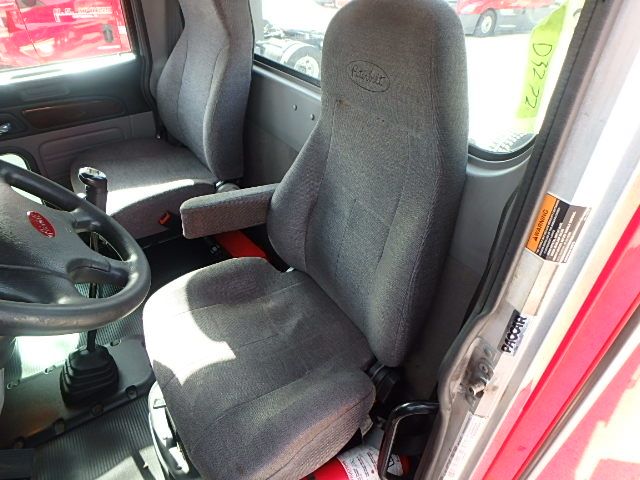 Peterbilt 386 truck interior showing driver seat and steering wheel in a daycab configuration.