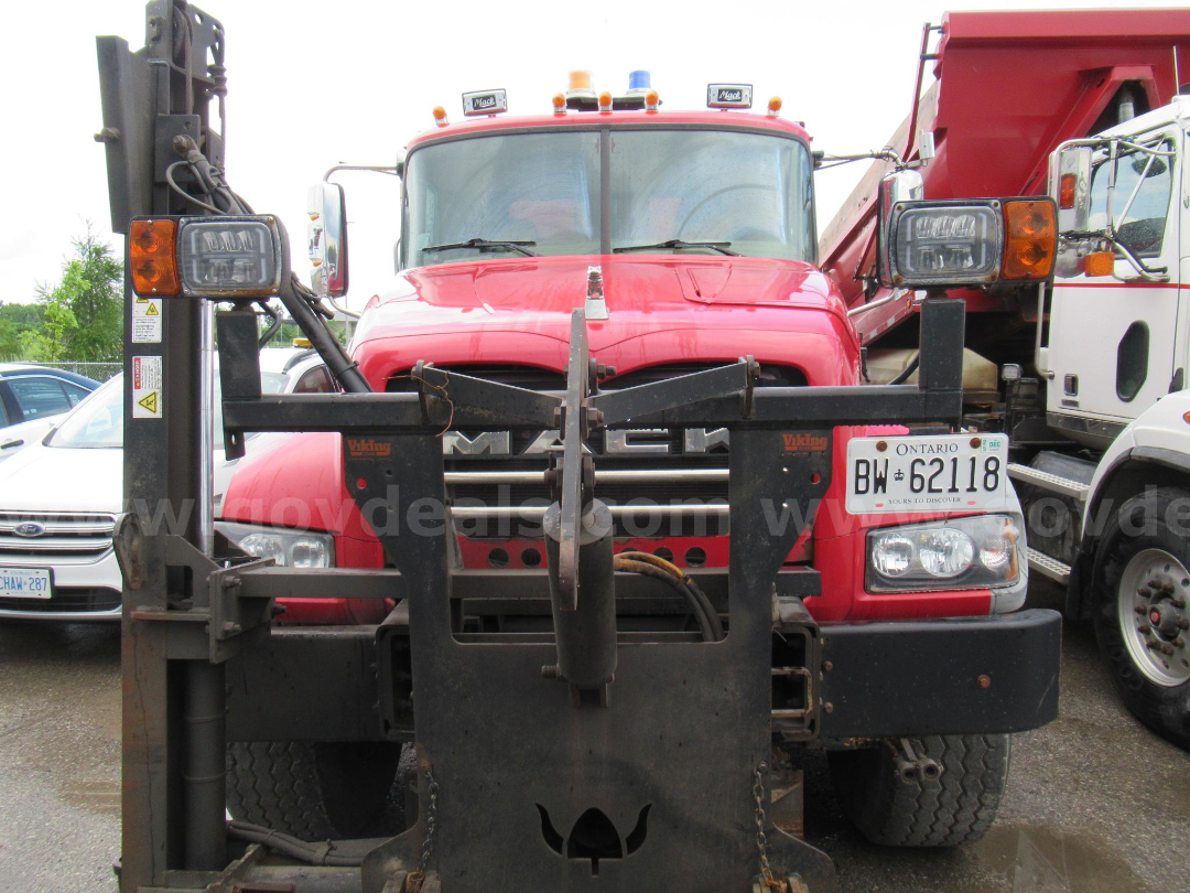Mack GU713 dump truck with front view and plow attachment showing license plate BW 62118 and dual round headlights.