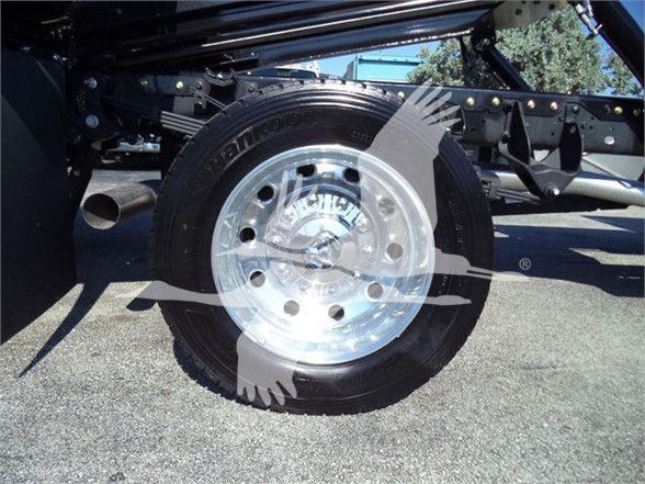 Ram 5500 wheel and tire undercarriage view showing polished steel rim and Hankook tire with vehicle frame components
