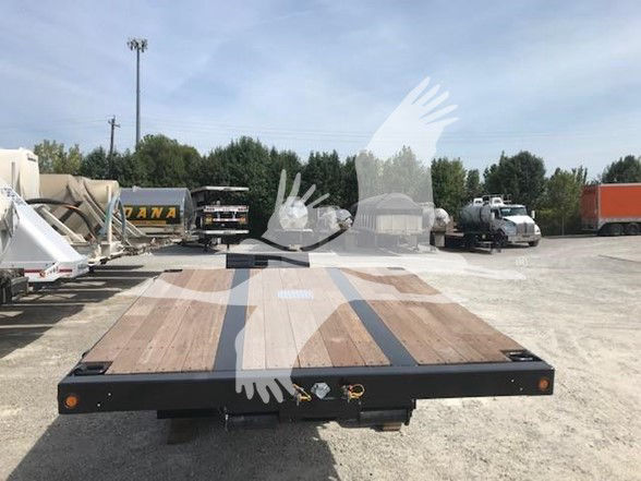 XL Specialized trailer flatbed with wooden deck and aluminum pullouts, view of rear end.
