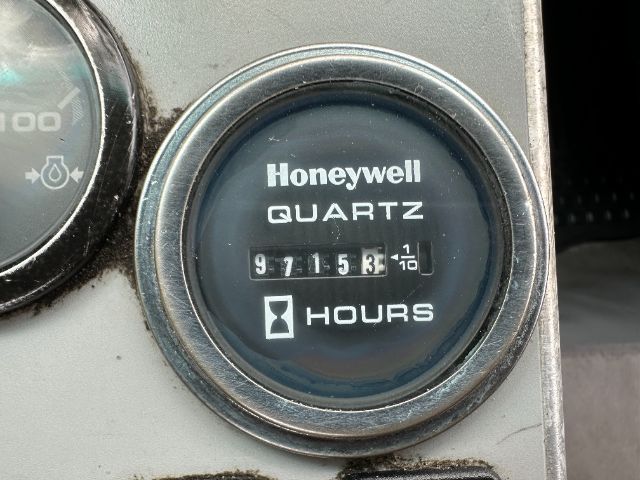Honeywell quartz hour meter showing 97153 hours in a metal gauge housing.