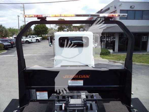 Peterbilt truck rear view showing frame, tow hitch, and branding on bed with a Jordan logo visible.