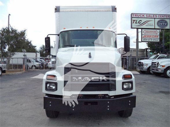 Front view of a white 2023 Mack MD7 box truck with large grille, rectangular headlights, and cargo box in the background.