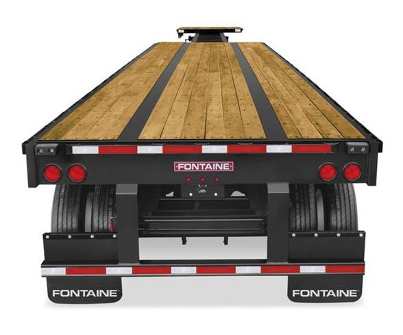 Flatbed trailer rear view showing wooden deck and dual wheel arches with Fontaine branding and taillights.