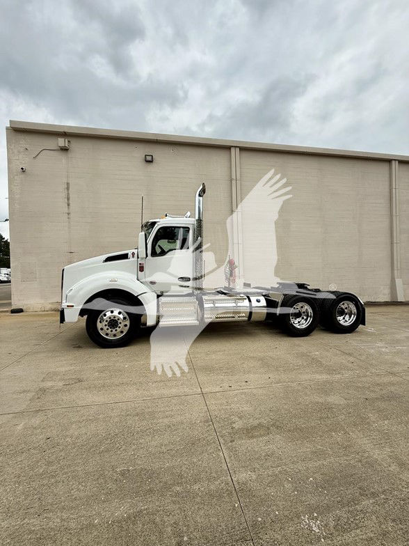 Kenworth T880 conventional daycab truck side view with white paint.