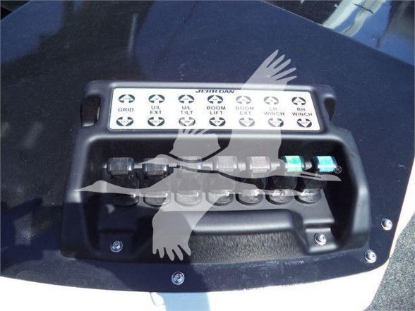 Ram 5500 dash labels showing various hydraulic port names and color-coded connectors with a control panel in a truck bed.
