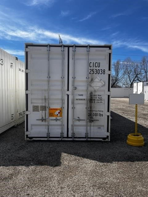 white CIMC intermodal dry container rear view with doors, serial 253038, tare and rating markings, 53FT length, located in yard.
