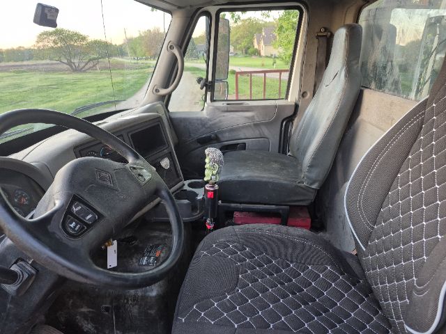 Interior view of a 2008 International 8600 truck cab with steering wheel, driver seat, and passenger seat visible.